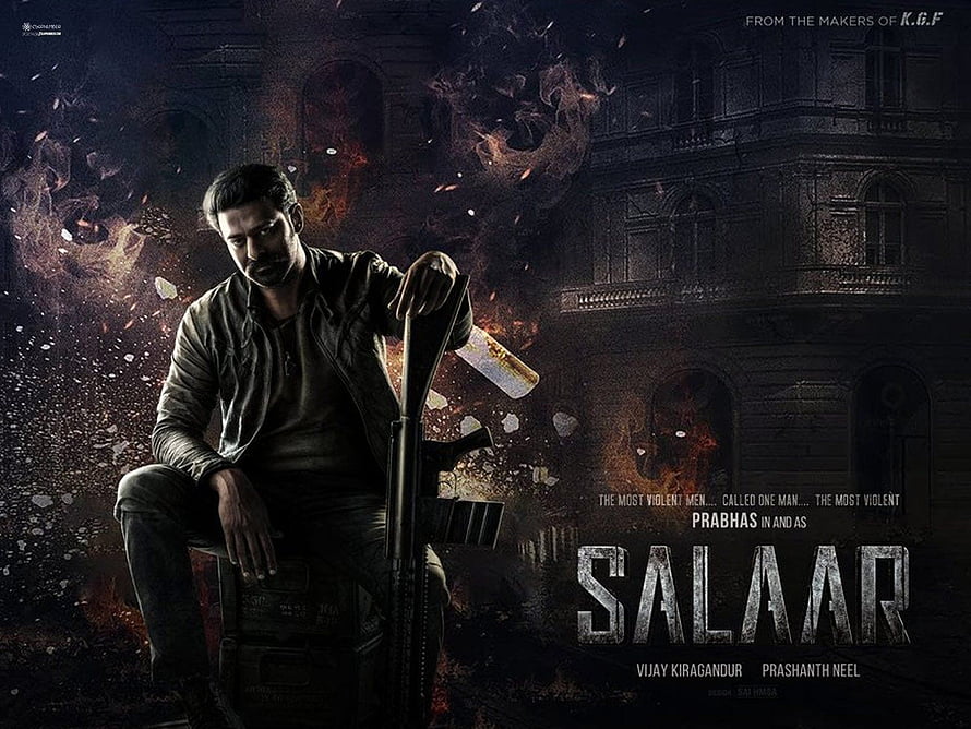 Prabhas as Salaar in Dark Action Movie Poster with Shotgun and Fire HD wallpaper