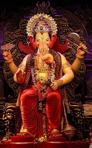 Lord Ganesha Seated on Ornate Throne with Red Drape and Golden Crown HD phone wallpaper