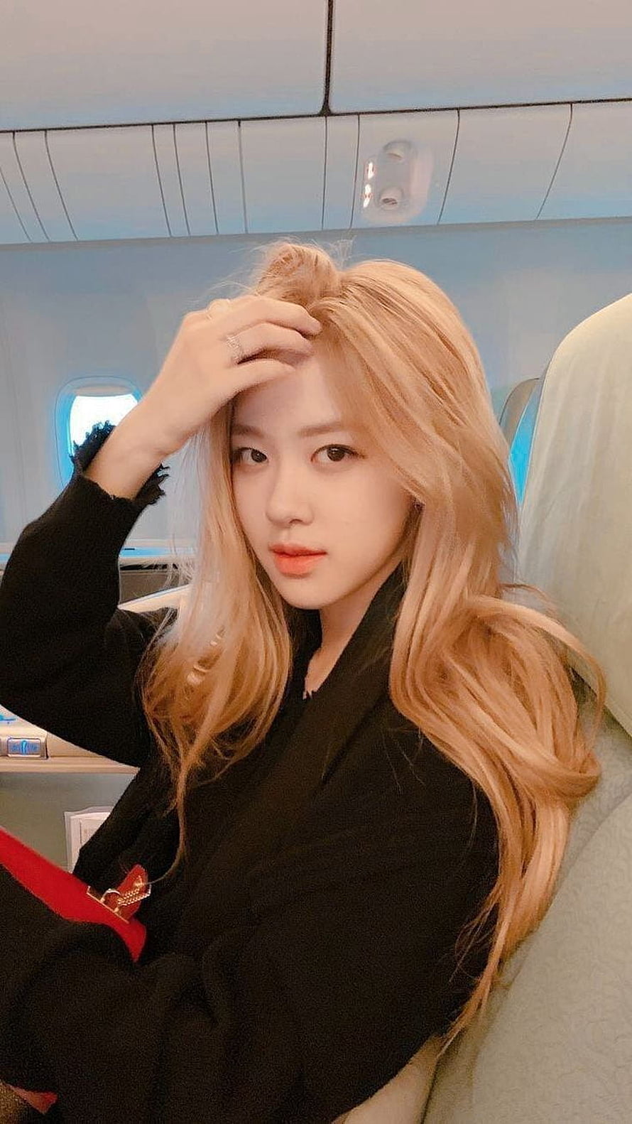 Rose from BLACKPINK with blonde hair on an airplane HD phone wallpaper