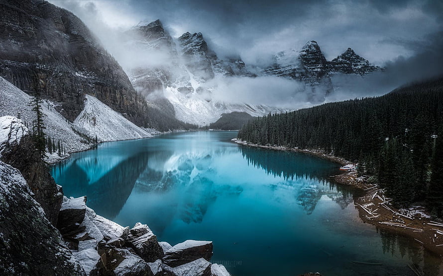 Moraine Lake in Banff National Park with snow-capped peaks and turquoise water HD wallpaper