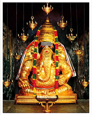Karpaga Vinayagar Golden Ganesha Idol with Hanging Oil Lamps and Flower Garland HD phone wallpaper