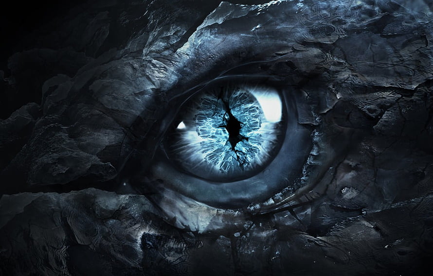 Glowing Dragon Eye in Dark Rock Cavern with Icy Blue Iris HD wallpaper