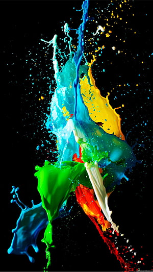 Vibrant multicolored paint splash frozen in motion against a deep black background HD phone wallpaper