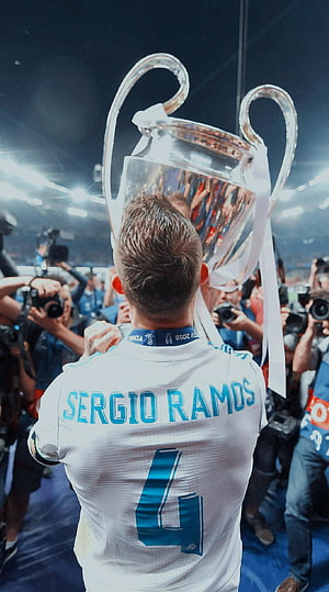 Sergio Ramos lifting the UEFA Champions League trophy in his Real Madrid white jersey HD phone wallpaper
