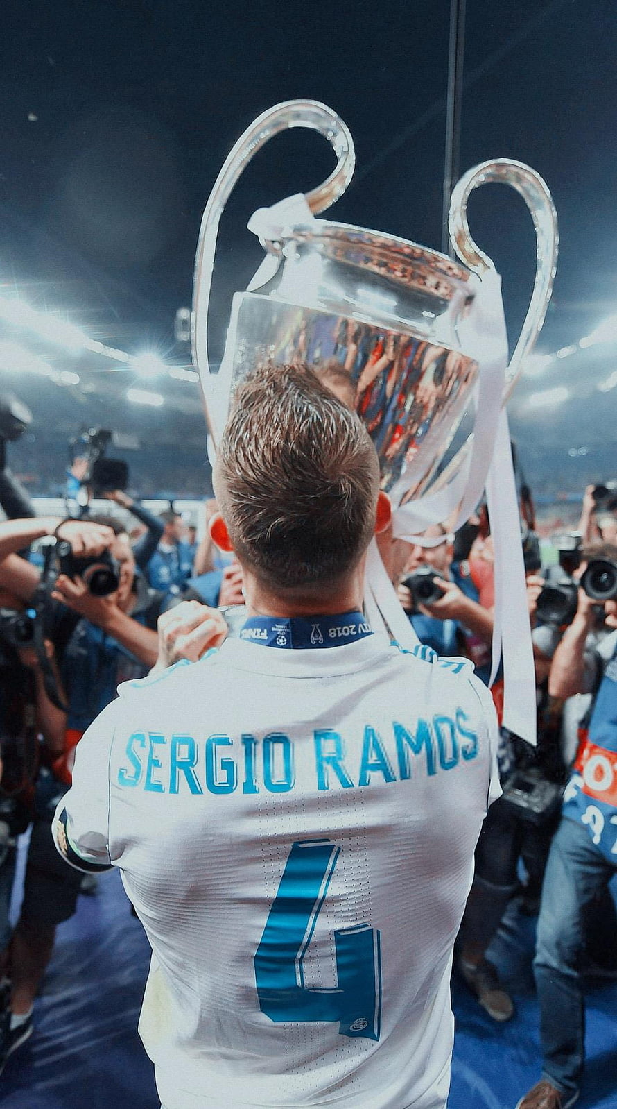Sergio Ramos lifting the UEFA Champions League trophy in his Real Madrid white jersey HD phone wallpaper