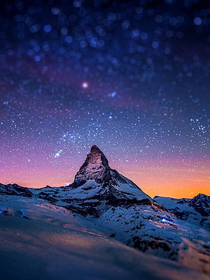 Matterhorn Peak Under a Starry Winter Night Sky with Bokeh Lights HD phone wallpaper