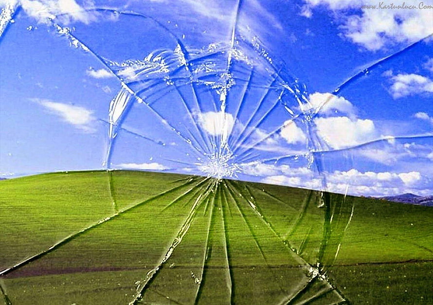 Cracked Glass Effect Over Green Rolling Hills and Blue Sky Landscape HD wallpaper