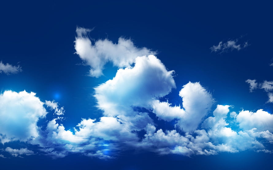 Vibrant Blue Sky With Fluffy White Cumulus Clouds And Sun Flare HD wallpaper