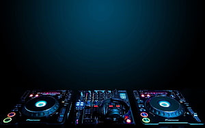 Pioneer DJ Setup with Turntables and Mixer in Dark Club Lighting HD wallpaper