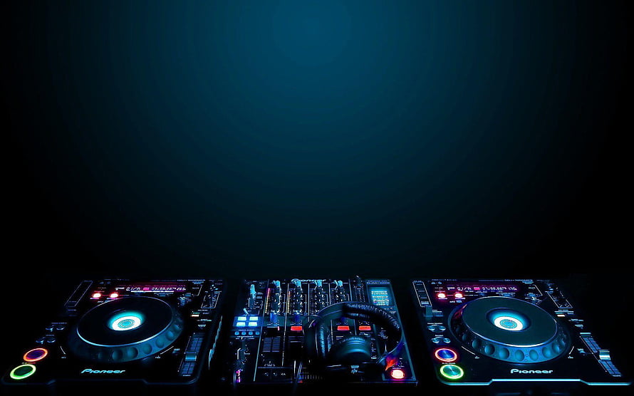Pioneer DJ Setup with Turntables and Mixer in Dark Club Lighting HD wallpaper