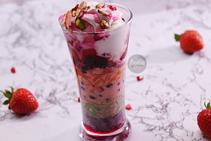 Layered Strawberry Falooda Dessert with Ice Cream and Nuts in a Tall Glass HD wallpaper