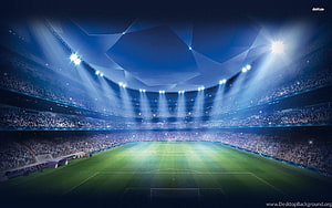 Illuminated Football Stadium Interior with Bright Floodlights and Full Crowd HD wallpaper