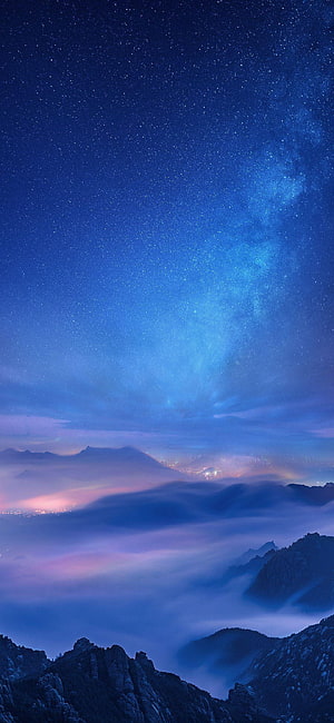 Starry Night Sky Over Mountain Peaks With Sea of Clouds and City Lights HD phone wallpaper