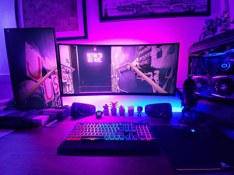 Vibrant RGB Gaming Desk Setup with Curved Monitor and Mechanical Keyboard HD wallpaper