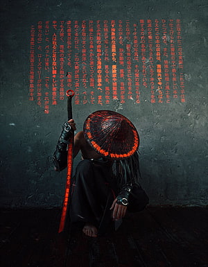 Cyber Samurai Warrior Crouching with Glowing Red Hat and Katana Against Dark Wall HD phone wallpaper