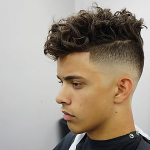 Modern Men's Undercut with Textured Curly Top and Clean Fade HD phone wallpaper
