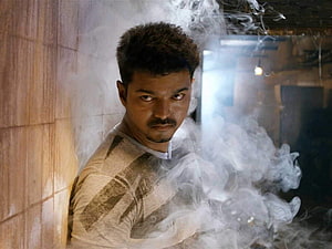 Vijay in Thuppakki: Intense Action Star Portrait Amidst Billowing Smoke HD wallpaper