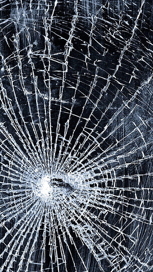 Shattered Glass Texture with Radiating Fracture Lines on Dark Background HD phone wallpaper