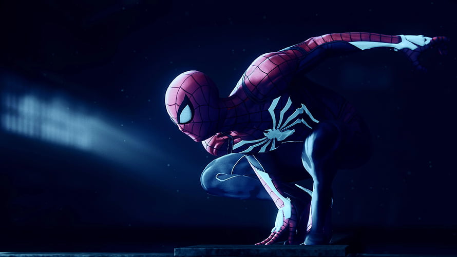 Spider-Man Crouched in Dramatic Spotlight Against Dark Background HD wallpaper