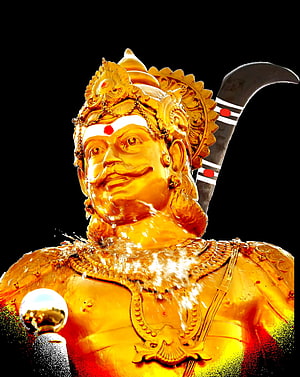 Golden Mutharaiyar Deity Statue with Water Ablution and Traditional Crown HD phone wallpaper