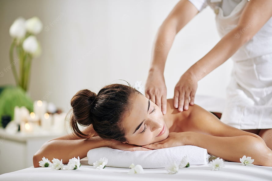 Relaxing Spa Massage Scene With Woman Receiving Back Treatment And White Flowers HD wallpaper
