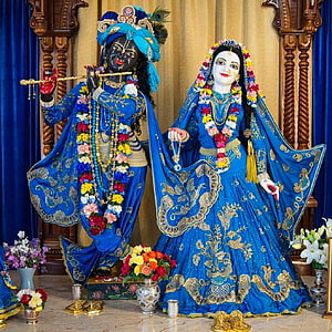 Krishna and Radha Temple Idols in Blue Silk Attire with Floral Garlands HD phone wallpaper