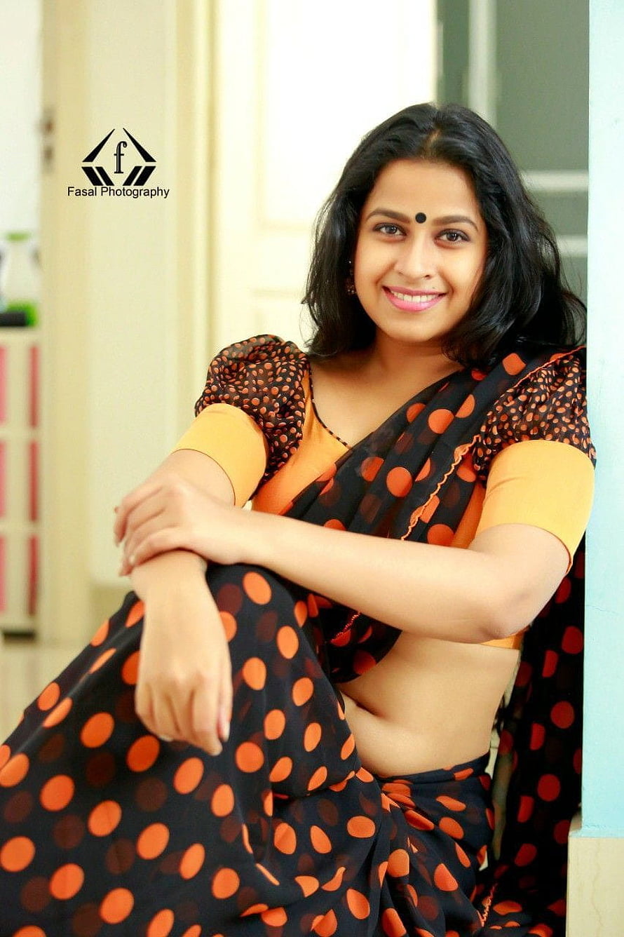 Sadhika Venugopal in a Black and Orange Polka Dot Saree HD phone wallpaper