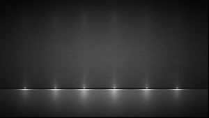 Minimalist Dark Grey Horizon with Reflective Light Points on a Smooth Surface HD wallpaper
