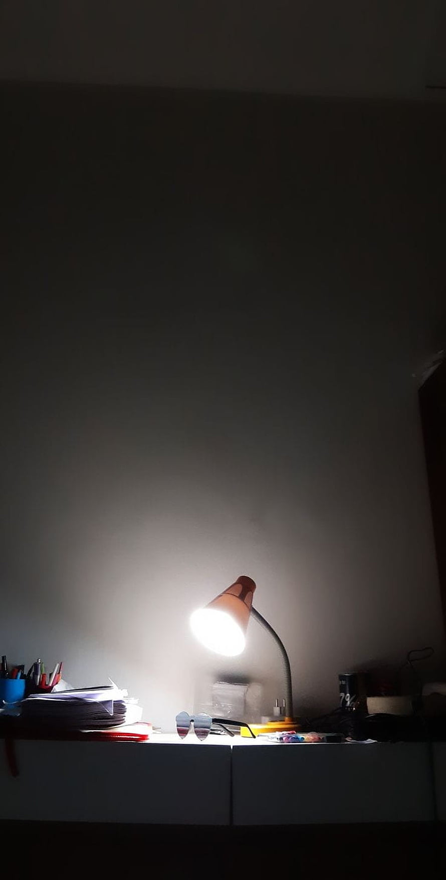 Moody Night Study Scene With Glowing Desk Lamp And Cluttered Workspace HD phone wallpaper