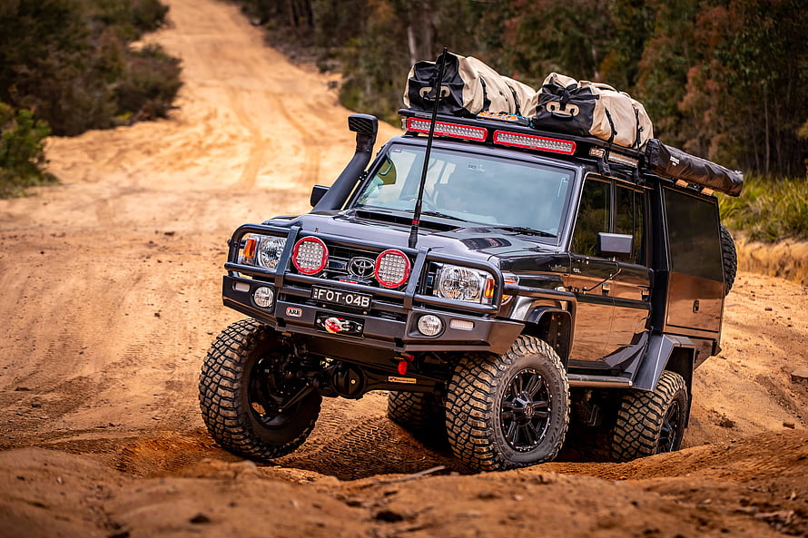 Black Toyota Land Cruiser 79 Series Off-Road Adventure on a Dirt Trail HD wallpaper