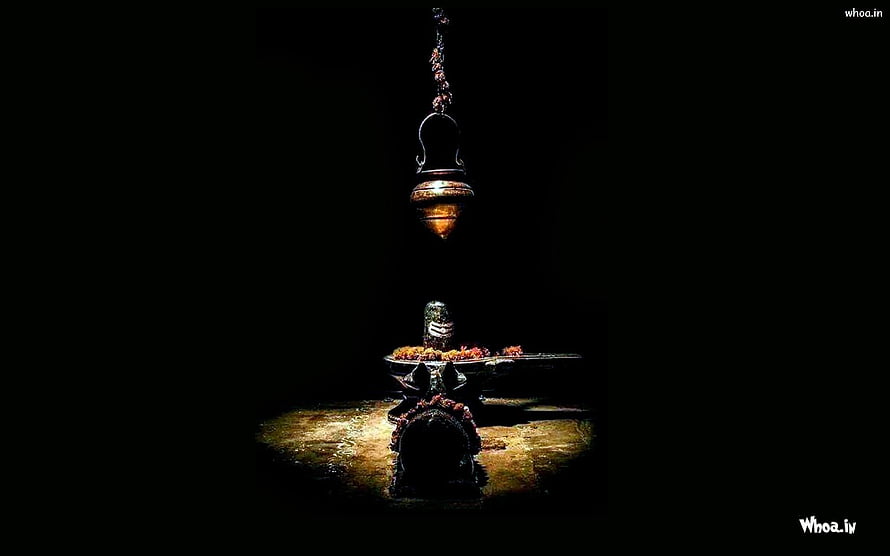 Lord Shiva Shivling with Hanging Oil Lamp in Dark Temple Setting HD wallpaper