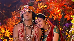 Radha Krishna in Traditional Indian Attire with Floral Headdresses and Jewelry HD wallpaper