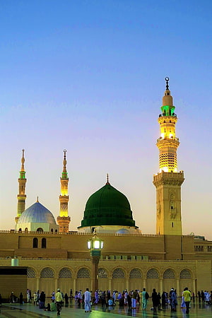 Prophet's Mosque in Medina at Dusk with Illuminated Minarets and Green Dome HD phone wallpaper