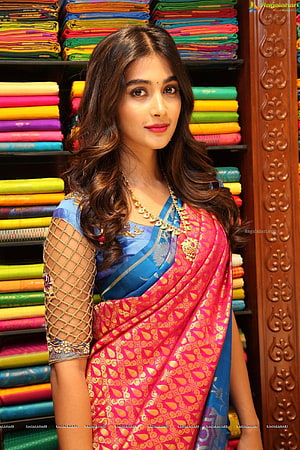 Pooja Hegde in a vibrant pink and blue silk saree with gold zari work and traditional jewelry HD phone wallpaper