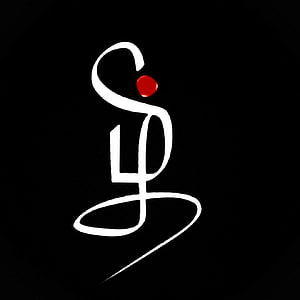 Minimalist Tamil Script Calligraphy with Red Accent on Black Background HD phone wallpaper