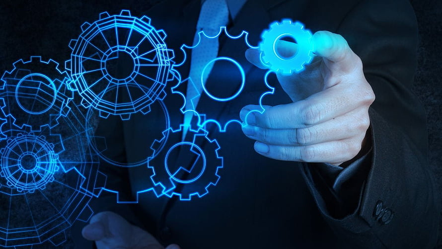 Businessman Interacting with Holographic Mechanical Gears and Engineering Schematics HD wallpaper