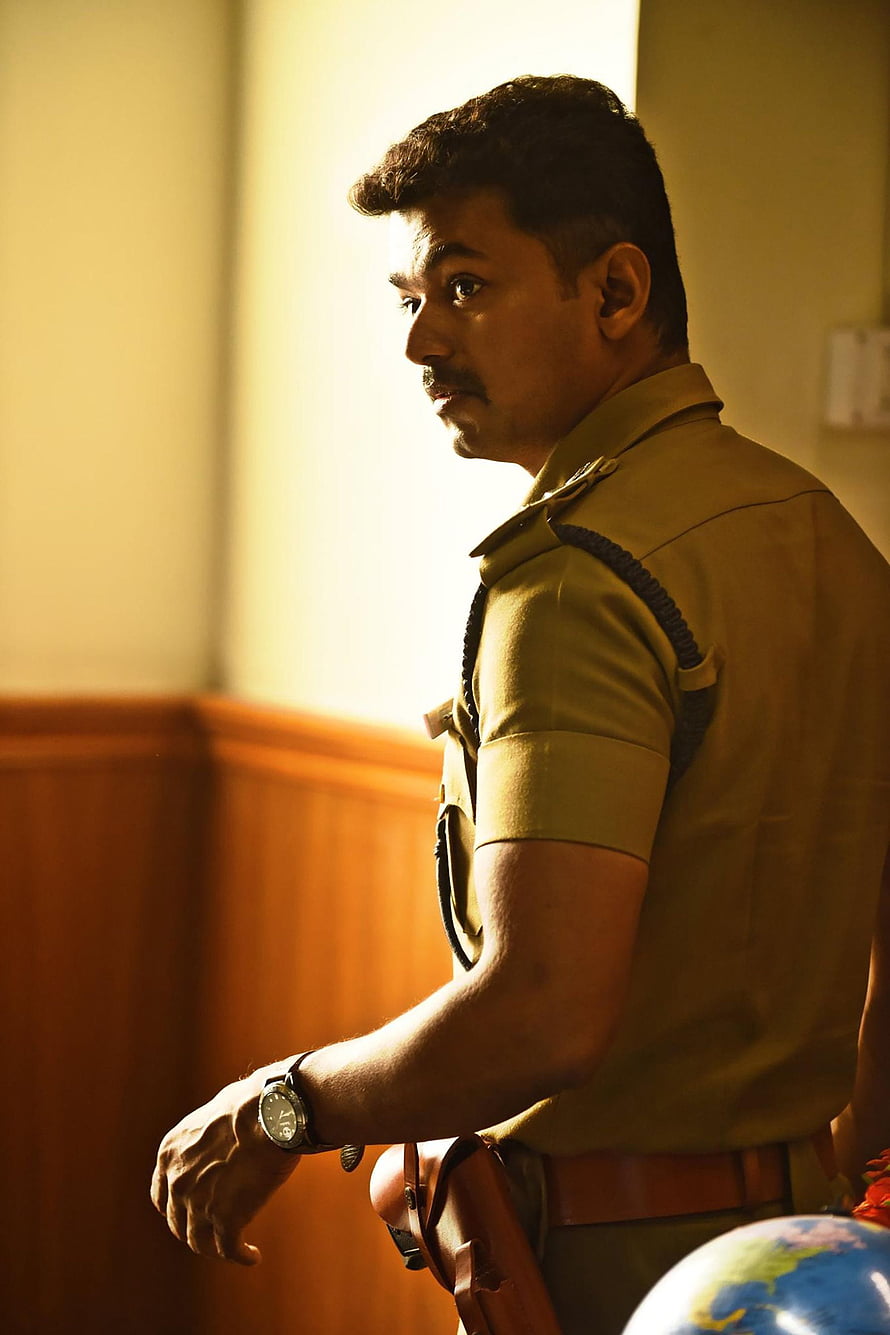 Vijay Kumar IPS in khaki police uniform with mustache and wristwatch in warm indoor light HD phone wallpaper