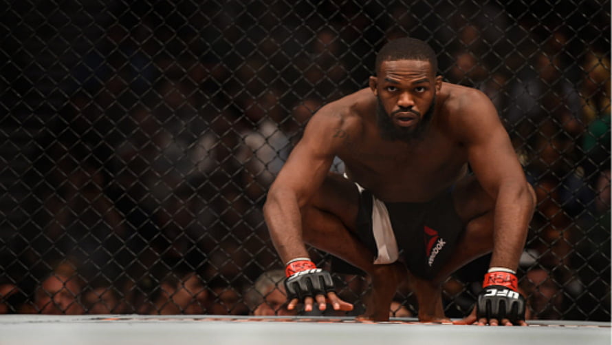 Jon Jones in Fighting Stance Inside the UFC Octagon Cage HD wallpaper