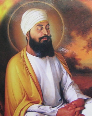 Guru Tegh Bahadur Portrait in White Turban and Yellow Robe with Golden Halo HD phone wallpaper