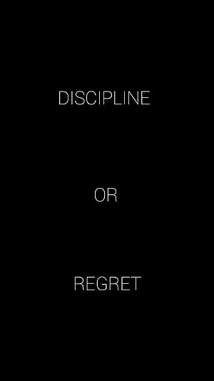 Minimalist Discipline or Regret Motivational Quote on Black Background HD phone wallpaper