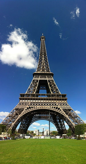Eiffel Tower Rising Above Green Lawns Under a Bright Blue Sky in Paris HD phone wallpaper