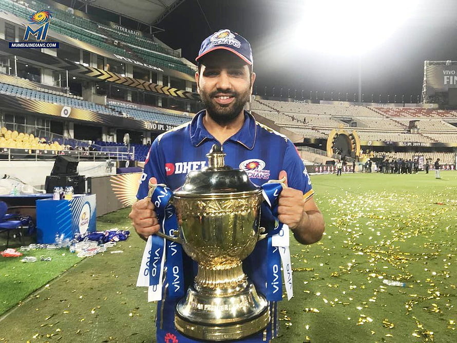 Rohit Sharma Lifting The IPL Trophy In Mumbai Indians Jersey At The Stadium HD wallpaper