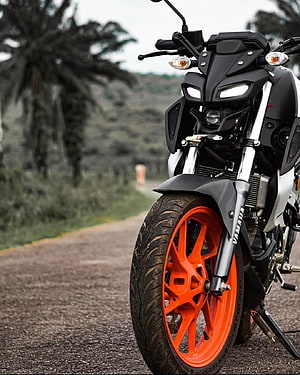 Yamaha MT-15 V2 Streetfighter Motorcycle with Orange Wheels on a Scenic Country Road HD phone wallpaper