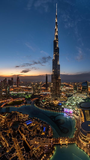 Burj Khalifa and Dubai Fountain at Dusk with City Lights and Skyline HD phone wallpaper