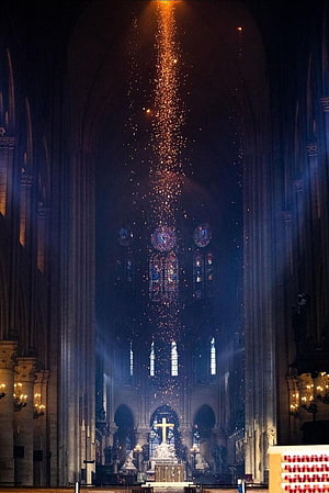 Cathedral Interior with Stained Glass Windows and Glowing Embers Rising Toward the Vaulted Ceiling HD phone wallpaper
