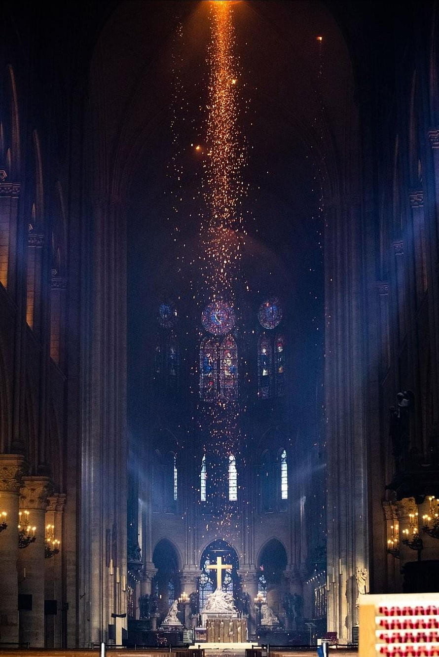 Cathedral Interior with Stained Glass Windows and Glowing Embers Rising Toward the Vaulted Ceiling HD phone wallpaper