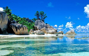 Tropical Island Beach with Granite Boulders and Crystal Clear Turquoise Water HD wallpaper