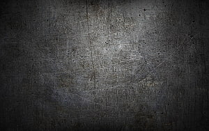 Dark Scratched Metal Surface with Industrial Grunge Texture and Vignette HD wallpaper