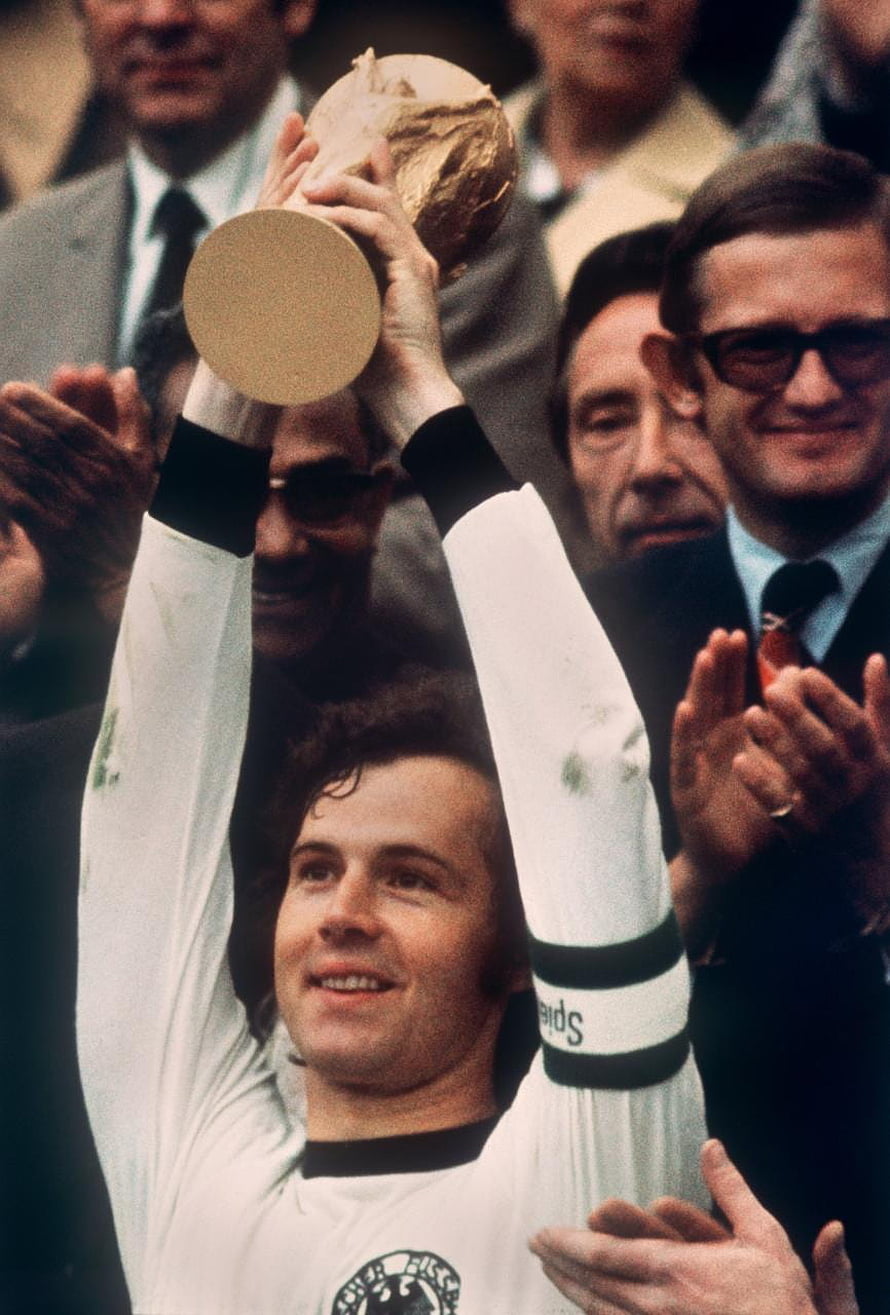 Franz Beckenbauer Lifting the FIFA World Cup Trophy in a Classic White Jersey HD phone wallpaper