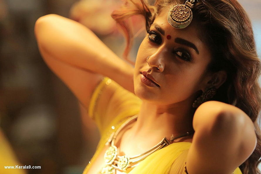 Nayanthara in Traditional Yellow Attire with Ornate Jewelry and Hair Ornament HD wallpaper